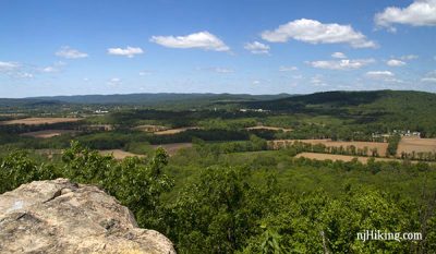 View of farmland in the valley below a viewpoint