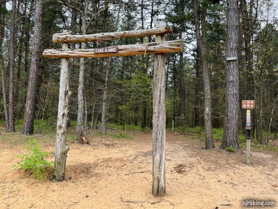 Wooden info board at the start of a trail.